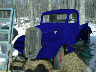 Badly photoshopped paint job on rusty 1935 Ford pickup