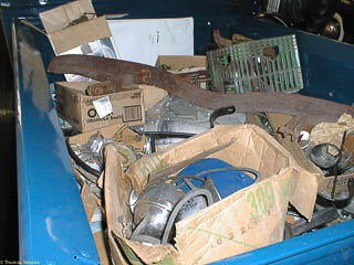 Boxes of extra parts in bed of 1935 Ford pickup