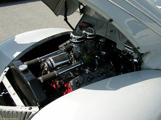 Flathead engine with polished generator and dual carburetors in 1940 Ford sedan