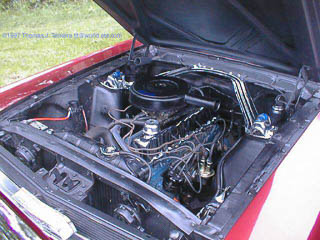 Six cylinder 200ci Mustang engine with aftermarket chrome valve cover