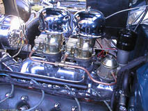 Ford flathead V8 engine with polished aluminum intake and dual Stromberg 97 carburetors