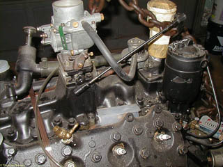 Top of French flathead V8 showing carburetor, fuel pump and mechanical governor