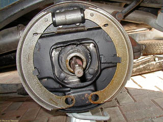 Brake shoes in position held only by a spring and clips on the backing plate