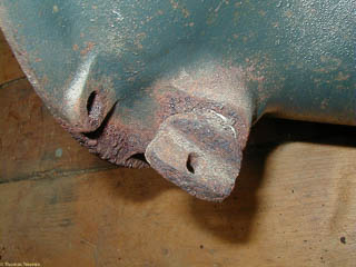 Rusty transmission case showing clutch linkage