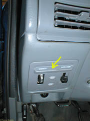 Dashboard light dimmer panel. The yellow arrow points to a lip to help remove the panel.