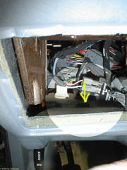Yellow arrow points to the top of the retaining clip