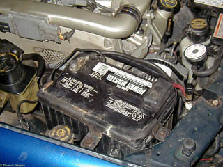 Tighten the hold down bracket on the battery
