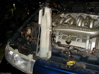 Radiator overflow bottle removed