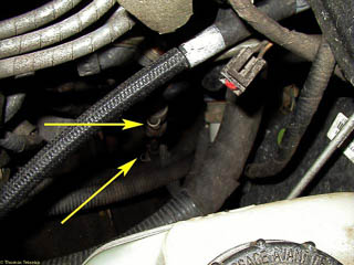 Arrows point to upper and lower sections of speedometer cable