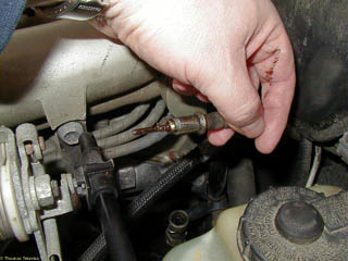 Better view of upper end of speedometer cable showing the lower half of the cable just below