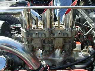 Weber carburetor with three air intakes on a Ford flathead three carburetor intake manifold