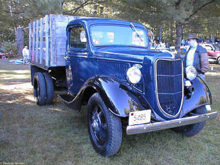 1936 Ford 1 1/2 ton truck. Dual wheels in back with a wood stake bed.