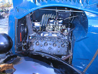 Engine compartment with freshly installed dual carburetors